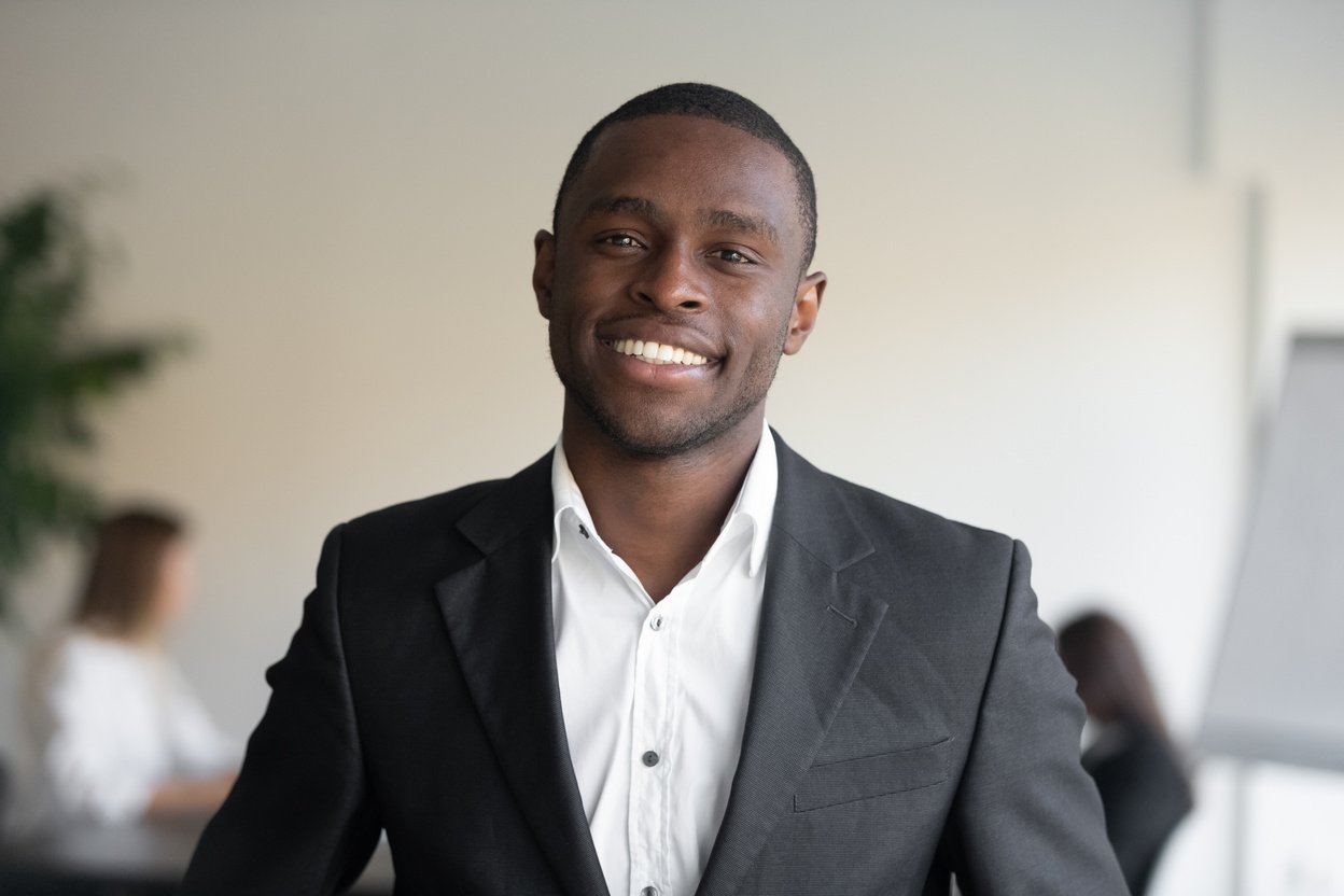 Headshot portrait African ethnicity head of sales department representative